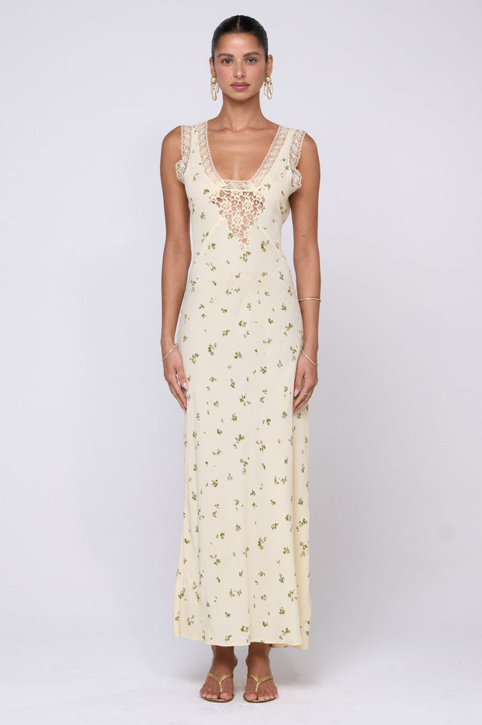 This is an image of Aimee Dress in Beurre - RESA featuring a model wearing the dress