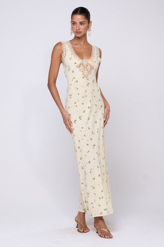 This is an image of Aimee Dress in Beurre - RESA featuring a model wearing the dress