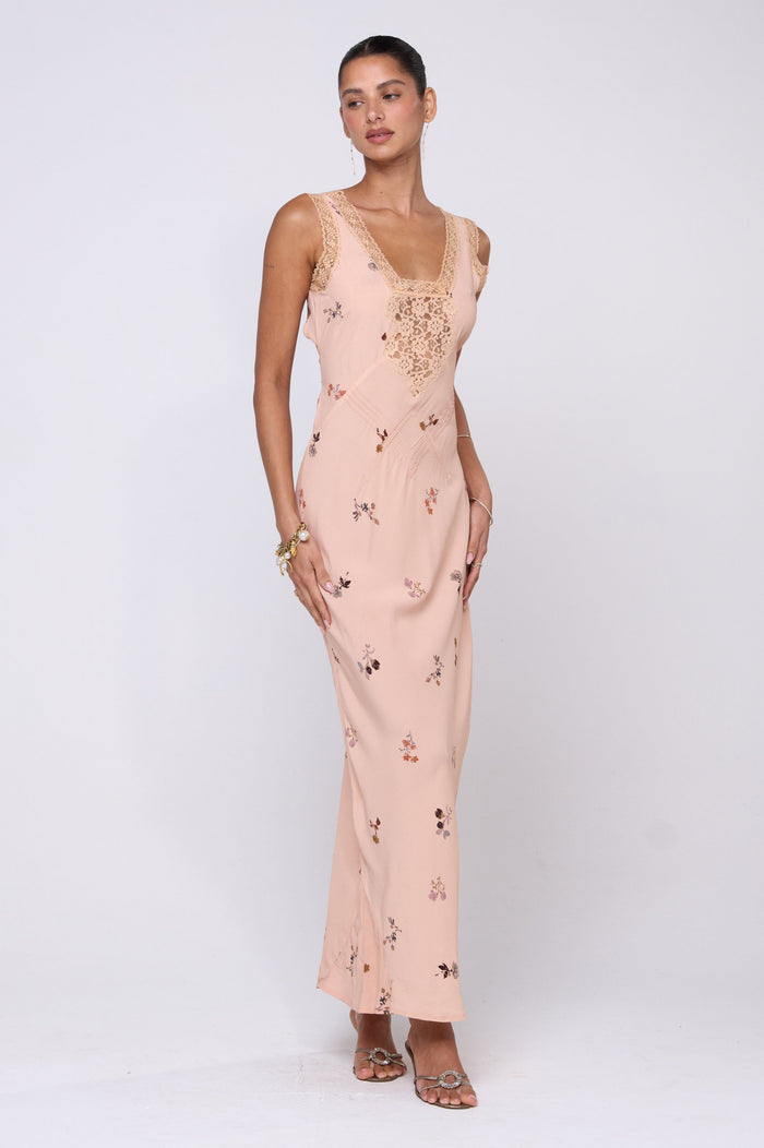 This is an image of Aimee Dress in Fleur - RESA featuring a model wearing the dress