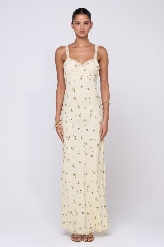 This is an image of Anais Dress in Beurre - RESA featuring a model wearing the dress