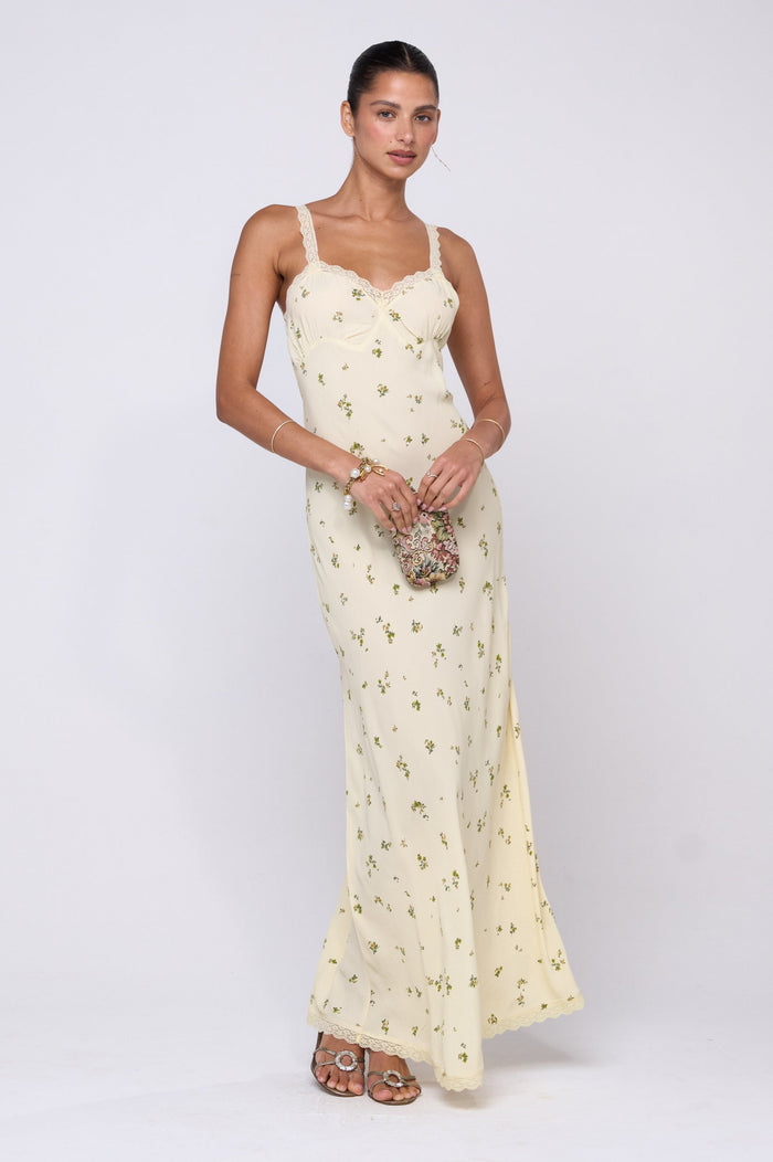 This is an image of Anais Dress in Beurre - RESA featuring a model wearing the dress