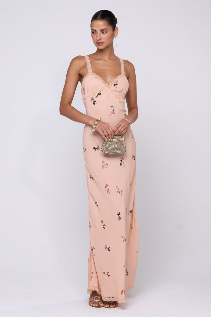 This is an image of Anais Dress in Fleur - RESA featuring a model wearing the dress