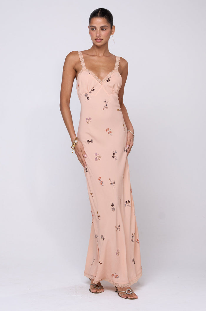 This is an image of Anais Dress in Fleur - RESA featuring a model wearing the dress