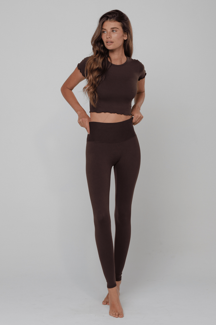 This is an image of Baby Tee Second Skin in Cacao - RESA featuring a model wearing the dress