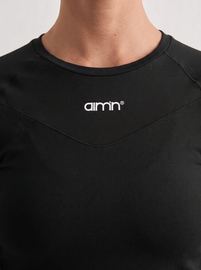 Musta aim'n Soft Basic Long Sleeve takaapäin, jossa on raglan-hihat ja vartalonmyötäinen second skin -tuntu.