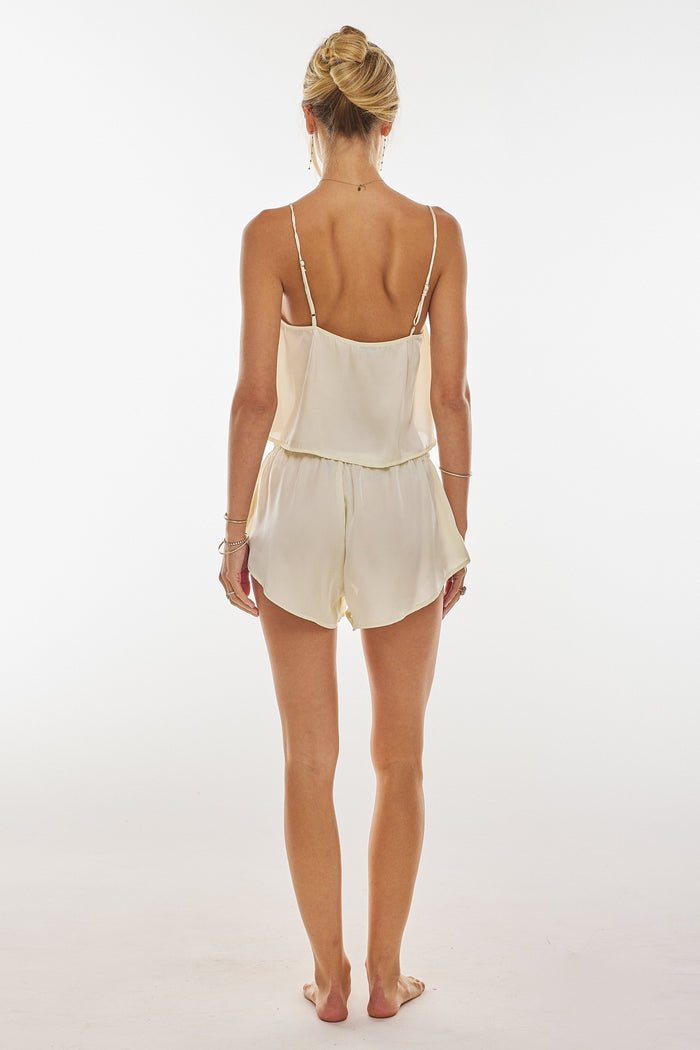 This is an image of Blair Top in Vanilla - RESA featuring a model wearing the dress