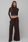 This is an image of Chase Pant Second Skin in Cacoa - RESA featuring a model wearing the dress