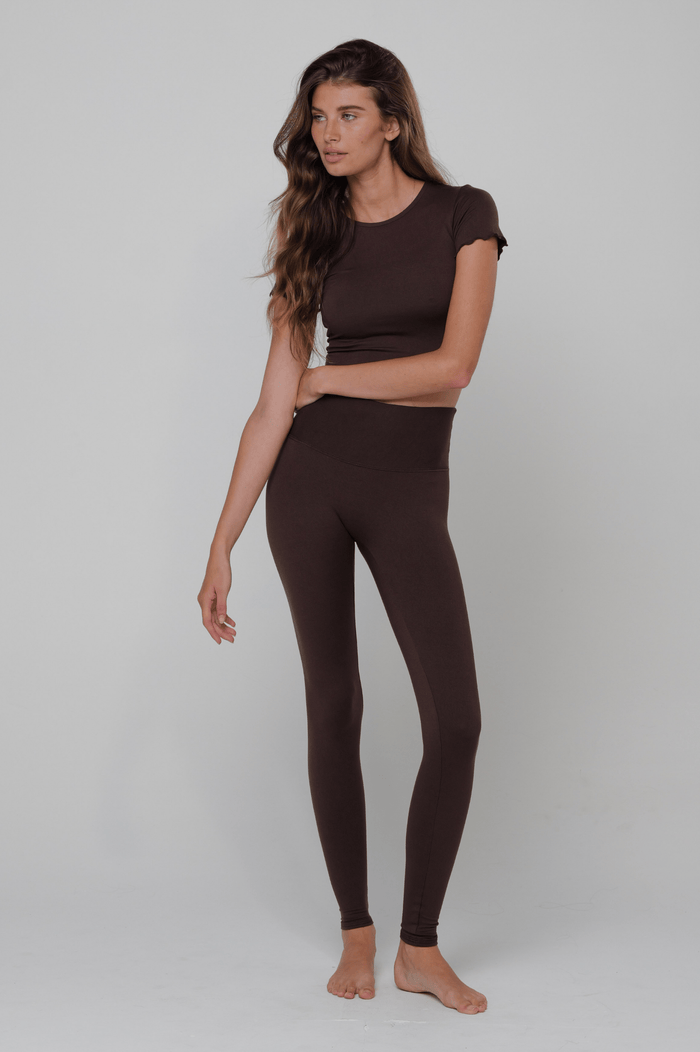 This is an image of Legging in Second Skin Cacao - RESA featuring a model wearing the dress