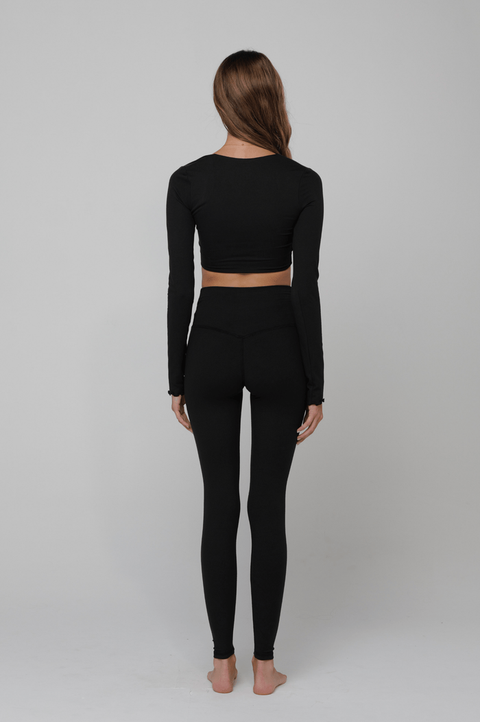 This is an image of Legging Second Skin in Black - RESA featuring a model wearing the dress