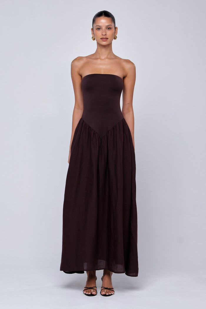 This is an image of Mackenzie Dress in Brown Linen - RESA featuring a model wearing the dress