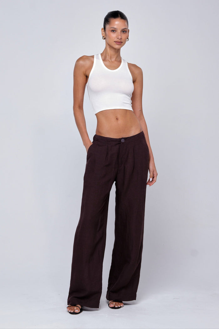 This is an image of Malcolm Trousers in Brown Linen - RESA featuring a model wearing the dress