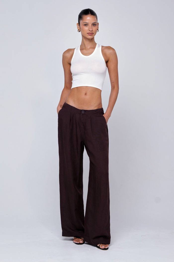 This is an image of Malcolm Trousers in Brown Linen - RESA featuring a model wearing the dress