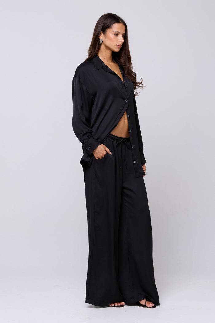 This is an image of Miley Set in Black - RESA featuring a model wearing the dress