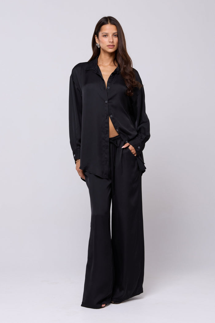 This is an image of Miley Set in Black - RESA featuring a model wearing the dress