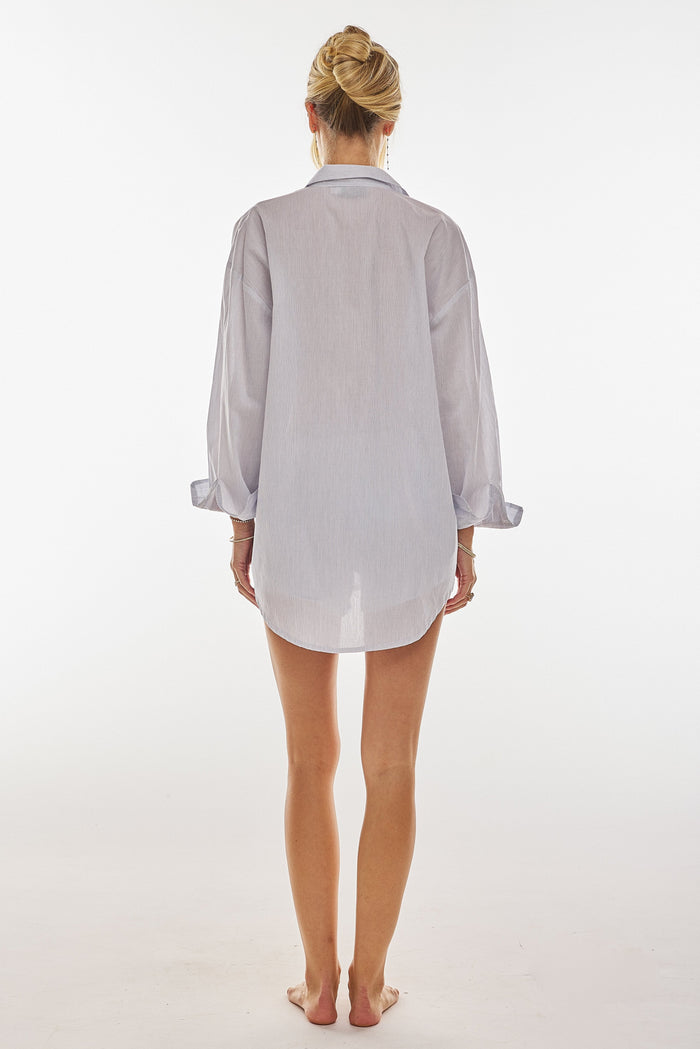 This is an image of Monica Blouse in Cloud - RESA featuring a model wearing the dress