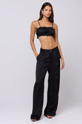 This is an image of Sasha Trouser in Black - RESA featuring a model wearing the dress