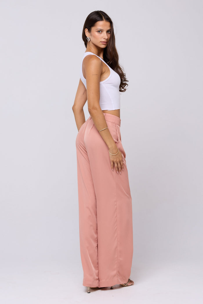 This is an image of Sasha Trouser in Blush - RESA featuring a model wearing the dress