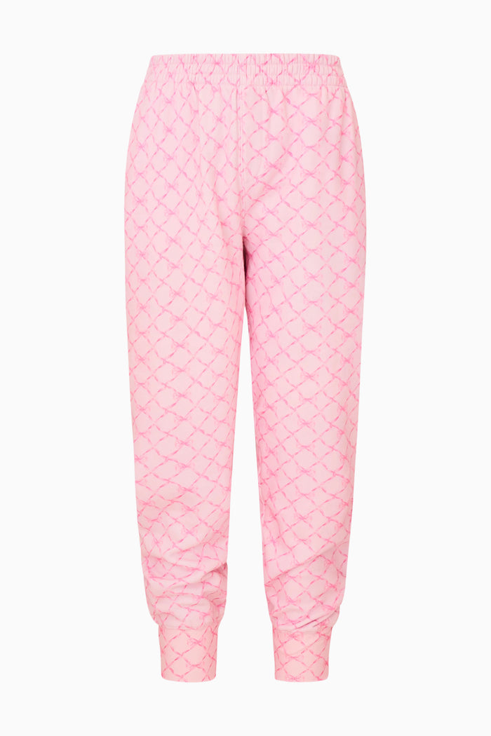 Pink bow print pants on a white background