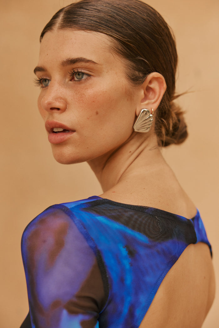 This is an image of Sylvia Dress in Lagoon - RESA featuring a model wearing the dress