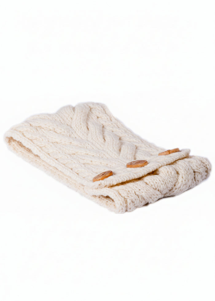 Knitted headband with wooden buttons on a white background